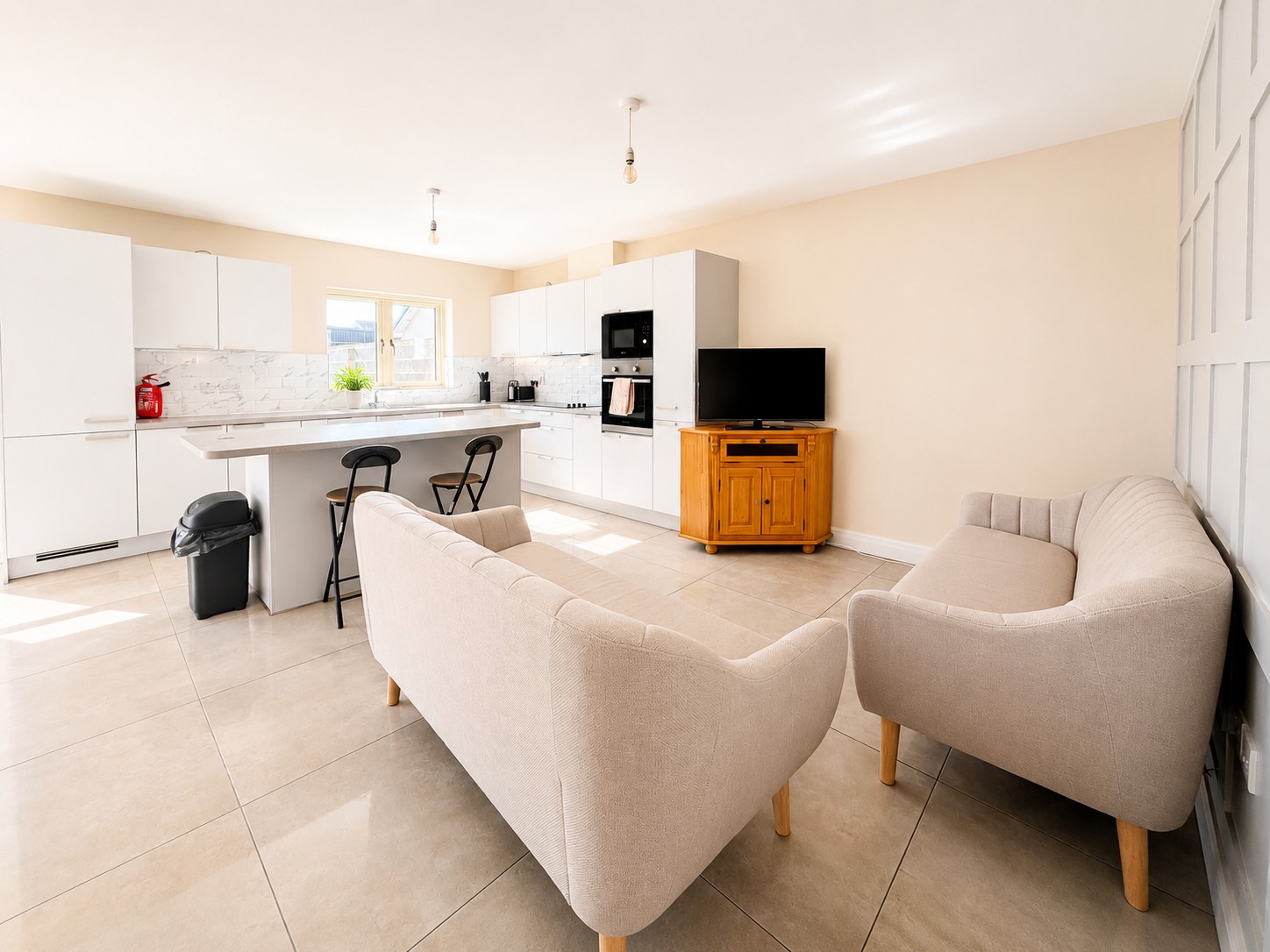 Fully furnished open-plan kitchen and living area in a CityStays house